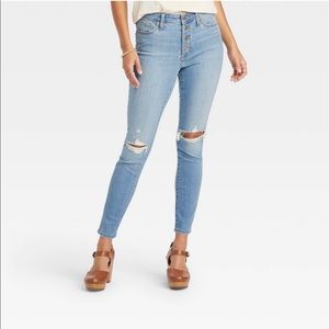 Universal Threads High Rise jeans with distressing on the knees areas.